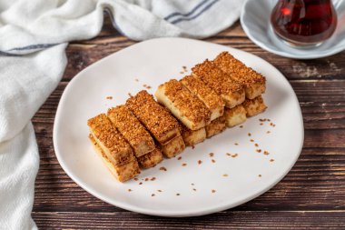 Sesame cookies. Bakery products. Salted sesame cookies on wood background. close up