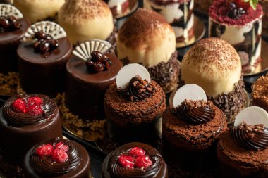 Types of cakes. Delicious cakes in bulk at the patisserie counter. close up