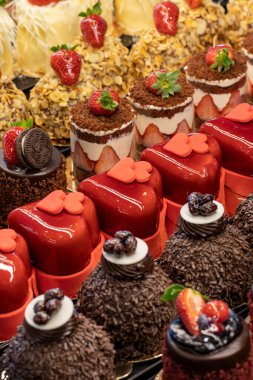 Types of cakes. Delicious cakes in bulk at the patisserie counter. close up