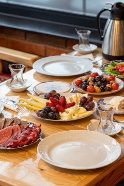 Ramadan table. The sahur table with cheese varieties, salami, pastrami, roasting, olives and tea