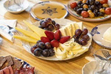 Ramadan table. The sahur table with cheese varieties, salami, pastrami, roasting, olives and tea