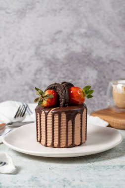 Cake. Chocolate and strawberry cake in a plate. close up