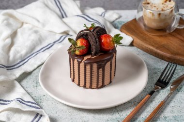 Cake. Chocolate and strawberry cake in a plate. close up