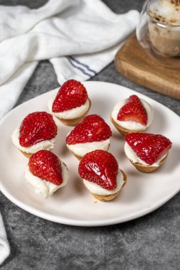 Strawberry tartlet. Delicious tartlet dessert on plate. close up