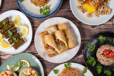 Ramadan table. Turkish food on wooden background. Iftar and sahur delicacies. Turkish oriental dishes. Types of appetizers. Top view