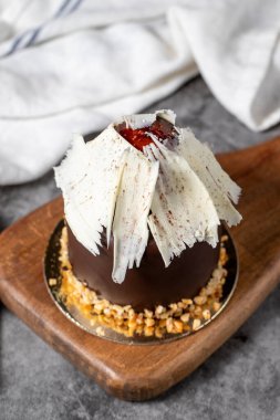 Chocolate and chestnut cake. Delicious cake on dark background
