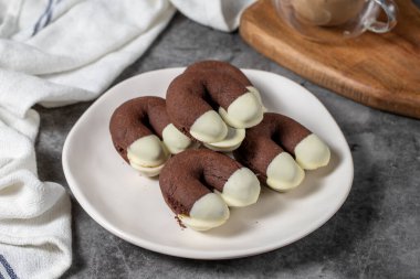 Cocoa and white chocolate cookies. Delicious cookies on dark background