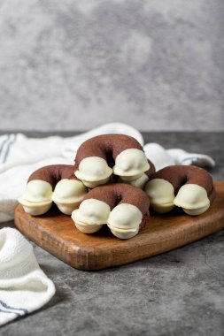 Cocoa and white chocolate cookies. Delicious cookies on dark background