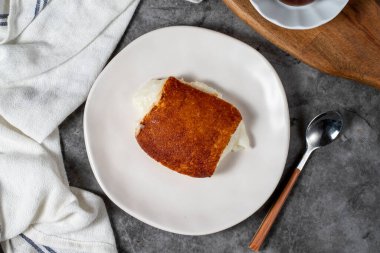 Milky dessert or Kazandibi. Traditional Turkish cuisine desserts. Kazandibi on a dark background. Top view