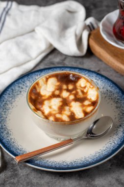 Rice pudding. Traditional Turkish cuisine desserts. Rice pudding dessert made with milk, sugar and rice on a dark background