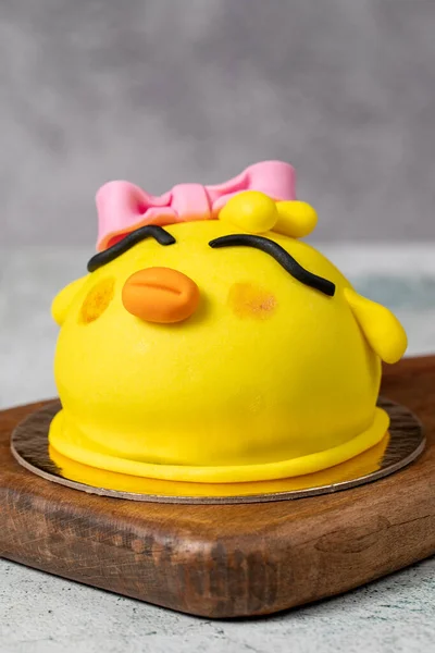 Special design bird shaped cake. Design cake for kids on gray background