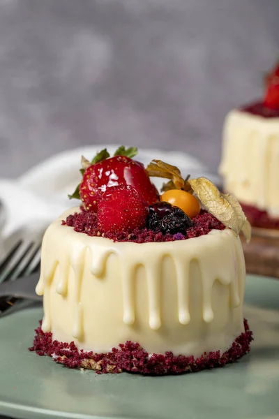 Fruit cream cake. Bakery desserts. Delicious round portion cake with strawberries and cream