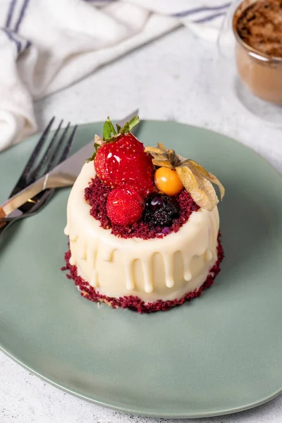 Fruit cream cake. Bakery desserts. Delicious round portion cake with strawberries and cream