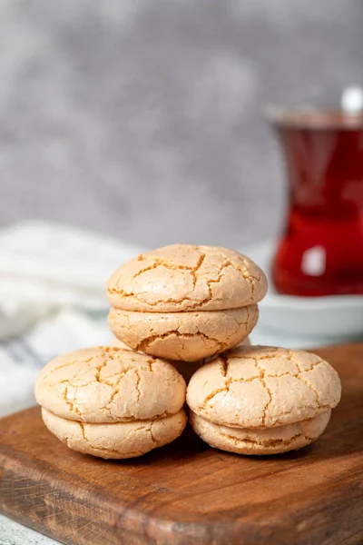 Almond cookies. Cookies made with almond flour on a stone background. Local name acibadem kurabiye. Patisserie sweets. Close up