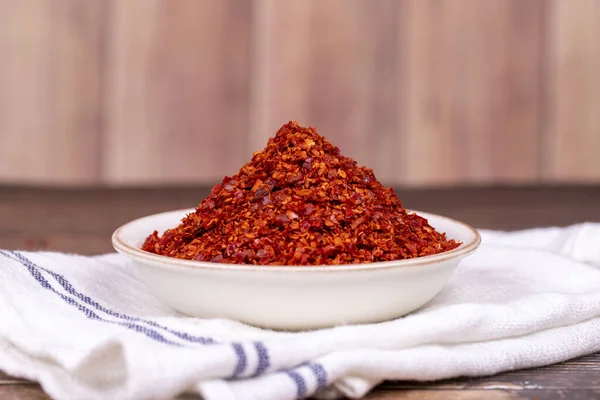 stock image Chilli pepper seedless flakes. Dried red pepper flakes in bowl. Spices and herbs.