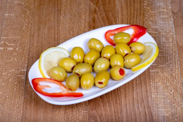 stock image Green stuffed olives. Naturally green olive in a ceramic bowl