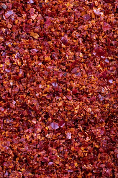 stock image Red chili flakes. Crushed chili pepper or dried chili flakes background. Spices background. Empty space for text. Top view