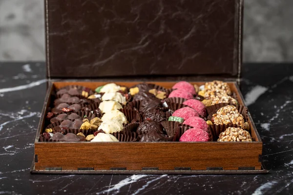 Packed chocolate box. Delicious truffle or praline chocolate assortment