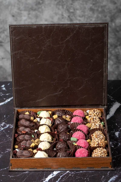 Packed chocolate box. Delicious truffle or praline chocolate assortment