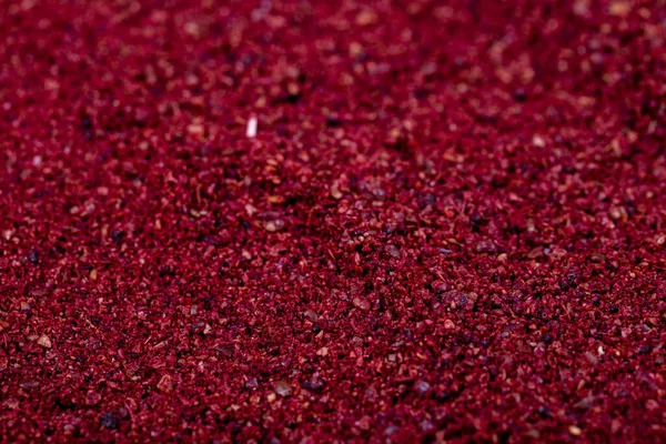 stock image Close-up sumac background. Dried ground red Sumac powder spices. Spices concept. Spice background.