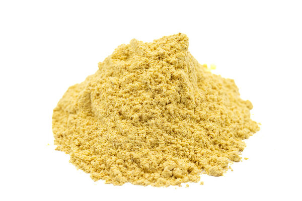 Ginger powder isolated on white background. Pile of ginger powder