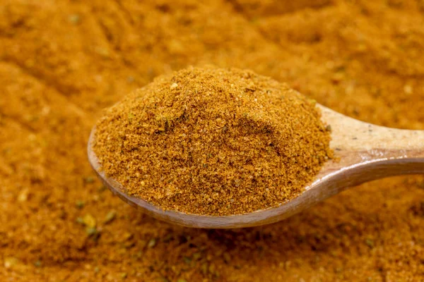 stock image Pile of cajun powder as background, spice or seasoning as background. Close-up of cajun powder in wooden spoon