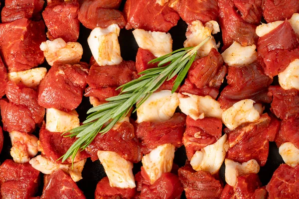 stock image Beef skewer. Close-up raw beef skewers. Food background