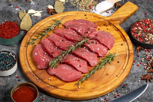 Beef Tenderloin. Fresh raw beef tenderloin on dark background. Butcher products