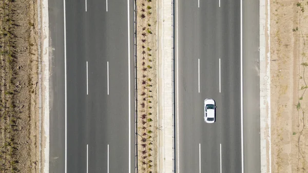 Aerial top down view of a three lane major highway. transportation concept