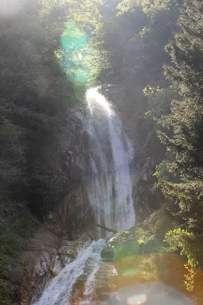 Manle waterfall. Waterfall flowing in the green forest. Manle Waterfall in Rize ikizdere