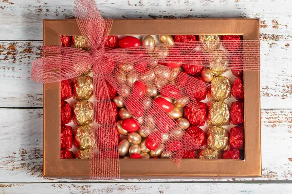 Packaged chocolate box. Pastry product. Gift chocolate box prepared with various chocolates on a white background. Top view