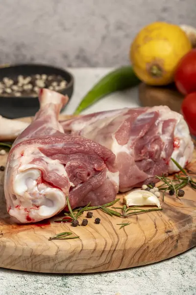 Lamb\'s shank. Butcher products. Lamb shank steak with bones on stone background