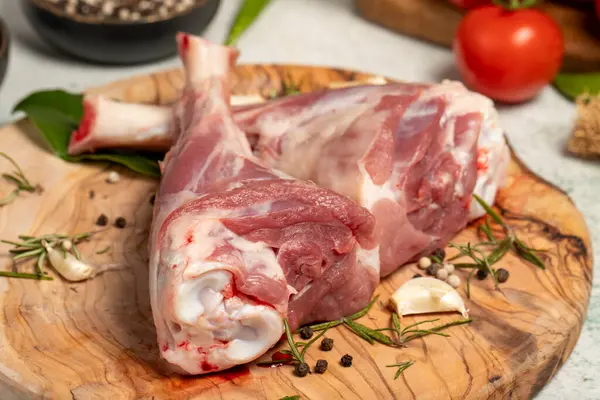 Lamb\'s shank. Butcher products. Lamb shank steak with bones on stone background