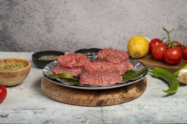 Ground beef. Butcher products. Raw ground beef on stone background