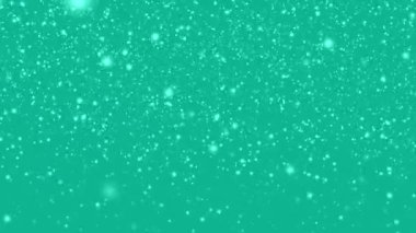 Many white snowflakes falling down on a blue background