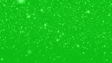 Many white snowflakes falling down on a blue background