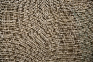  Kırsal çuval bez kumaş dokusu doğal olarak. Kuaför kumaşından kumaşlar, eski bej halı arka planı..