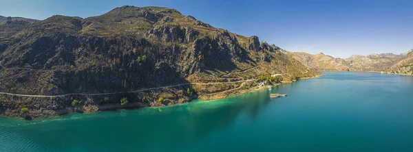 stock image Wide panoramic shot of beautiful Oymapinar Lake with turquoise water in Turkey. Clear blue sky. Lake made of the dams on the Manavgat River. High quality photo