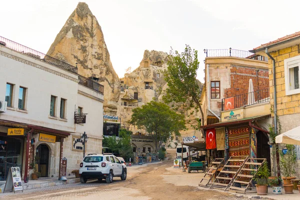 stock image 10.11.2022 Cappadocia, Turkey. Beautiful morning in the Turkish city of Cappadocia. Houses, shops, and local places in front of ancient cave rock formation. High quality photo