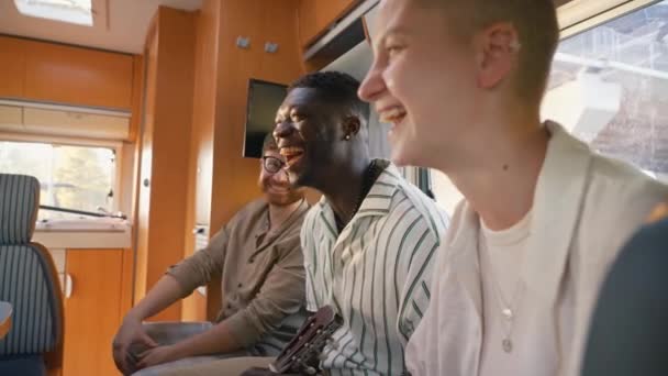 Three Young Adult Friends Camping Sitting Camper Van Relaxing Telling — Stock Video