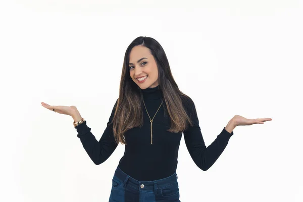 stock image good-looking dark-haired girl shrugging shoulders over white bacground, medium shot studio shot. High quality photo