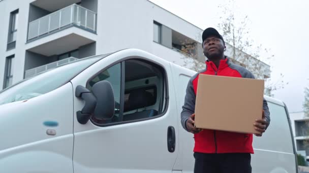 Black Young Adult Delivery Man Wearing Work Uniform Standing White — Stock Video