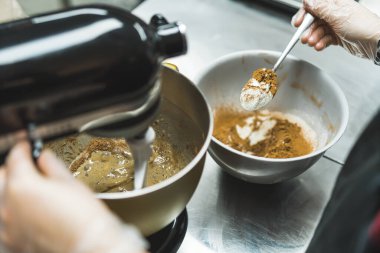 baker preparing dough and mixing ingredients, baking concept. High quality photo