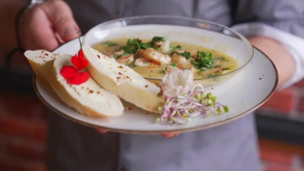 Elegant Waiter Serving Dish Plate Bread Shrimps Hot Sauce Blurred — Stockvideo