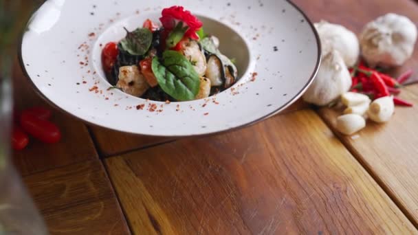Unrecognizable Waiter Serving Shrimp Dish Black Tagliolini Pasta Prawns Herbs — Stockvideo