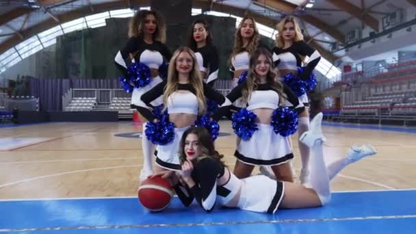 Cheerleaders Posing One Them Lying Floor Legs Holding Basketball High — Stok video