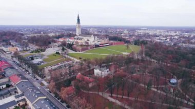 01.03.2023 Jasna Gora, Czestochowa, Poland. In the foreground park and gardens. In the distance stands the church against the background of the city landscape. High quality 4k footage