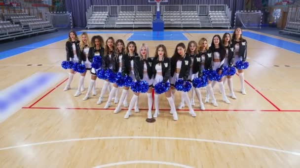 Cheerleaders Mini Skirts Captured Low Angle While Standing Pom Poms — Stockvideo