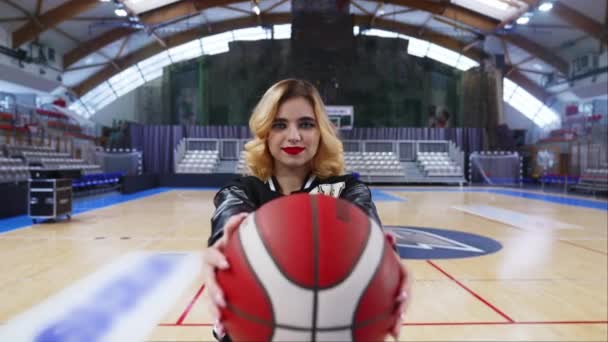 Blurred Foreground Basketball Held Blond Cheerleader Sport Concept Vertical Photo — стоковое видео