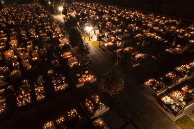 All Saints Day in Poland - drone aerial footage nighttime graveyard. High quality photo